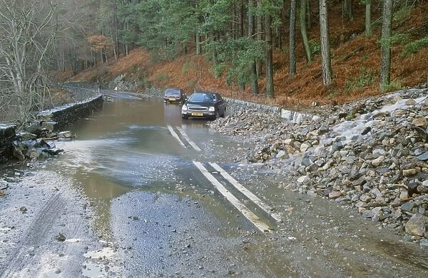 The A591 blocked by flood debris at Thirlmere in the Lake District UK