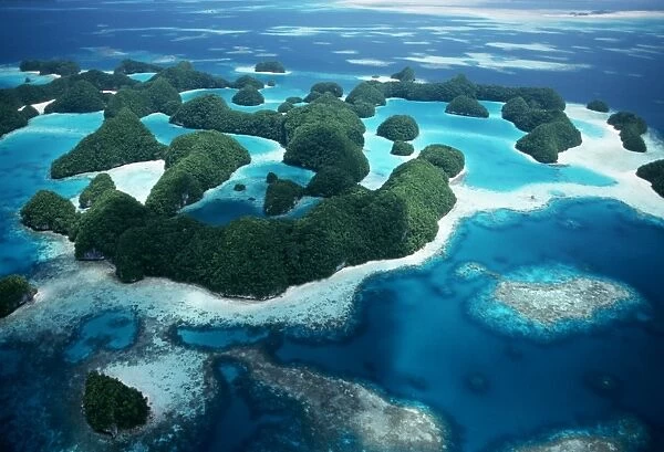 Aerial view of islands and reef complexes. Micronesia