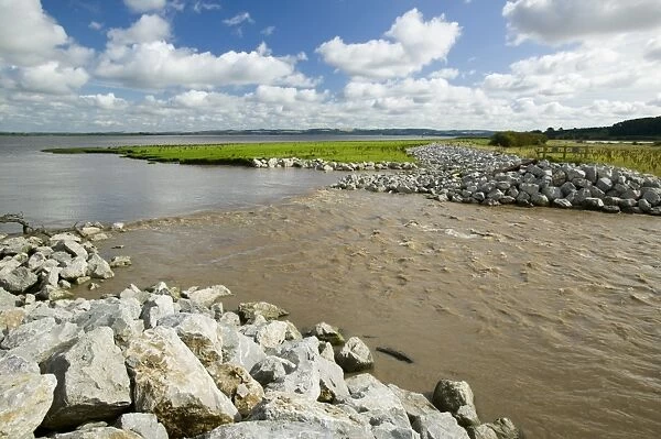 The Breach at Alkborough on the Humber Estuary in Eastern England. As sea levels rise around the world many areas of low lying land are at increasing risk of coastal flooding and are getting increasingly expensive to protect. In order to protect