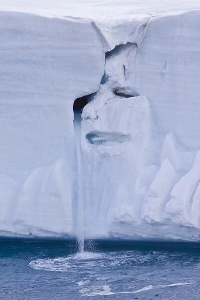 CREDIT: Michael Nolan  /  SpecialistStock CAPTION: The image of a crying face has appeared in a glacier off Norway. Tears in the natural sculpture on the Nordaustlandet ice shelf in the Svalbard archipelago are created by a waterfall of