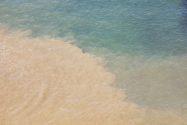Murky river water mixing with clear sea water at ilfracombe on the North devon Coast, UK