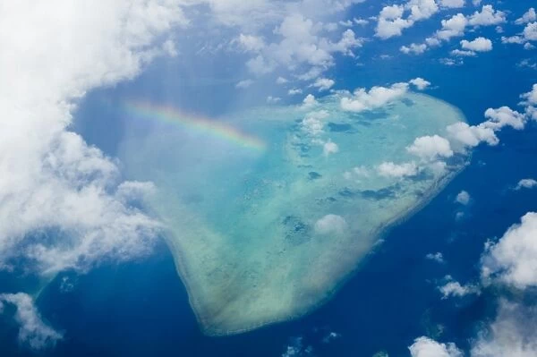A rainbow over tropical reef near Tuvalu in the Pacific ocean