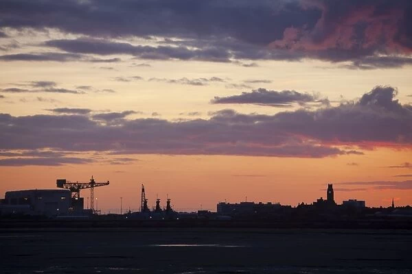 Sunset over Barrow in Furness town and shipyard, Cumbria, UK