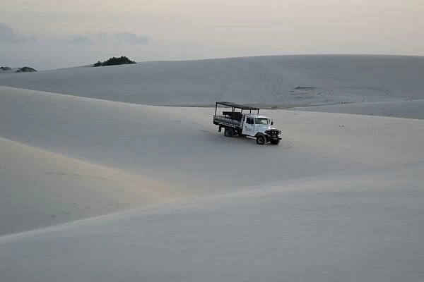 Truck trespassing sand dunes of Lencois Maranhenses National Park, Santo Amaro, Maranh o, Brazil (rr)