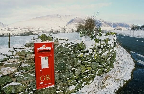 A winter post box in St Johns in the Vale in the Lake District UK