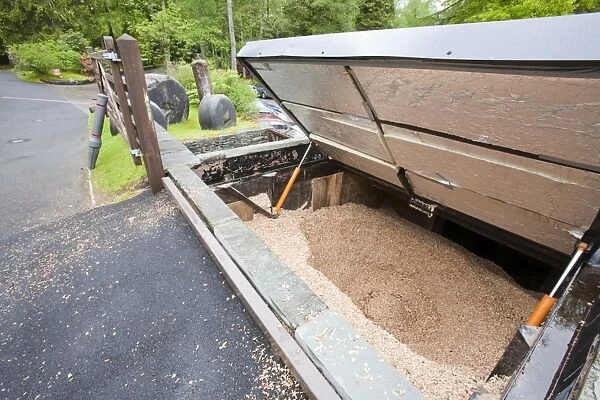 The woodchip hopper for a biofuel boiler in the grounds of the Langdale Timeshare in the Lake District, UK. Since the instalation of the biofuel boiler, which replaced an LPG gas boiler, the company has saved £30, 000 a year in running costs