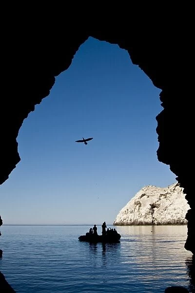 Zodiac approaching a cave at Isla San Pedro Martir in the midriff region of the Gulf of California (Sea of Cortez), Baja California Norte