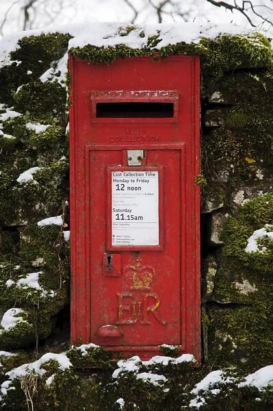 Royal Mail wall box postbox in moss covered wall with snow, Malham, Malhamdale, Yorkshire Dales N. P