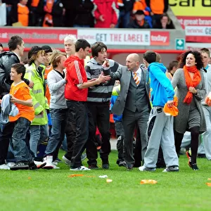 Championship Glory: Blackpool Fans Emotional Pitch Invasion as Ian Holloway Celebrates Title Win vs. Bristol City (02/05/2010)