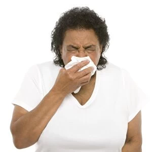 Senior woman sneezing