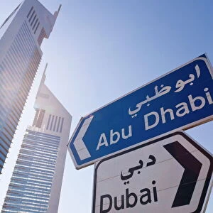 Street sign in front of the Emirates Towers on Sheikh Zayed Road