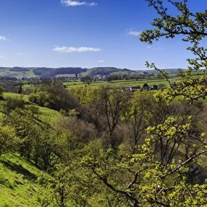 View towards Youlgreave from the slopes of Lathkill Dale in spring, Peak District National Park, Derbyshire, England, United Kingdom, Europe