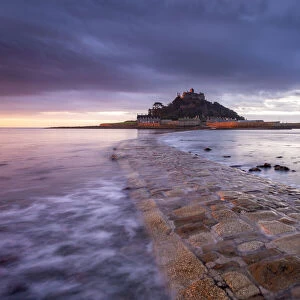 Stone causeway leading to St Michaels Mount at dawn, Cornwall, England
