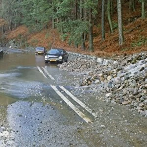 The A591 blocked by flood debris at Thirlmere in the Lake District UK