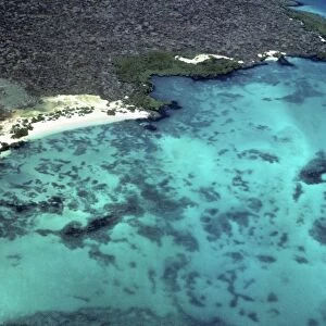 Aerial view of SW corner of Baltra with shallows and end of old WWII runway. Baltra, Galapagos Islands