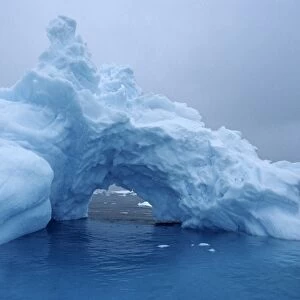 Detail of arch in iceberg. Paradise Bay, Antarctica