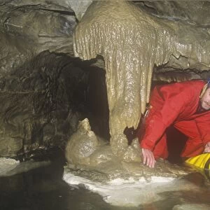 A caver in Kingsdale master cave, Yorkshire Dales, UK