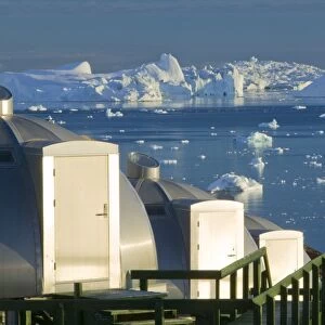 Igloos outside the Arctic Hotel in Ilulissat on Greenland. Ilulissat is a UNESCO World Heritage Site because of the Jacobshavn Glacier or Sermeq Kujalleq which is the largest glacier outside Antarctica. The glacier drains 7% of the Greenland ice