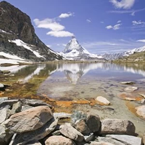The Matterhorn reflected in a mountain lake above Zermatt Switzerland