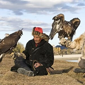 Kazakh hunters with Golden Eagles (Aquila chrysaetos), Altai Mountains, Bayan-Ulgii, Western Mongolia, october