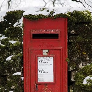 Royal Mail wall box postbox in moss covered wall with snow, Malham, Malhamdale, Yorkshire Dales N. P