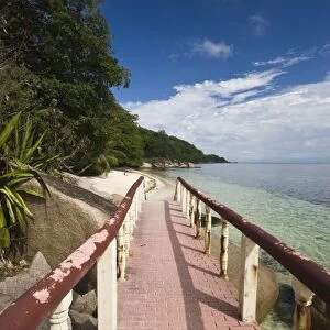 Seychelles, Praslin Island, Anse Bois de Rose, seaside promenade at the Coco de Mer hotel