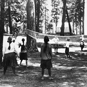 VOLLEYBALL, 1920. Girls at a YWCA camp at Fayette Lakes, Idaho