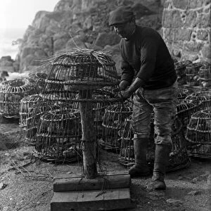 Crabpot making at Penberth, Shaping a crab pot. Cornwall. 1923