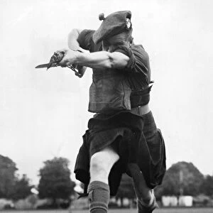 Scottish troops practice bayonet training in England. 21st September 1939