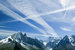 Airplane vapour trails over the Mer du glace Chamonix France Cause Airplane vapour trails over the Mer du glace Chamonix France Cause