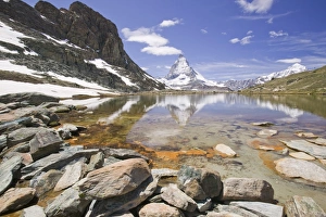 The Matterhorn reflected in a mountain lake above Zermatt Switzerland The Matterhorn reflected in a mountain lake above Zermatt Switzerland
