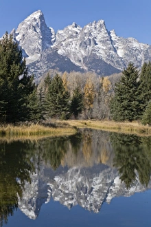 Reflected light on water from the Grand Teton Mountain Range, outside of Jackson Hole Reflected light on water from the Grand Teton Mountain Range, outside of Jackson Hole