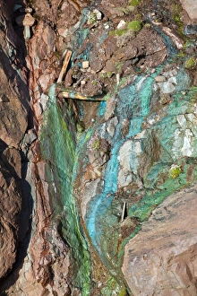Sea Cliffs stained green from copper deposits leaching from the old Geevor Tin Mine near St Just in Cornwall Sea Cliffs stained green from copper deposits leaching from the old Geevor Tin Mine near St Just in Cornwall