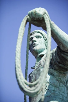 A statue of a young fisherman by local artist Tom Leaper in Newlyn is a memorial to fishermen lost at sea, Cornwall A statue of a young fisherman by local artist Tom Leaper in Newlyn is a memorial to fishermen lost at sea, Cornwall