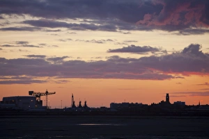 Sunset over Barrow in Furness town and shipyard, Cumbria, UK. Sunset over Barrow in Furness town and shipyard, Cumbria, UK.