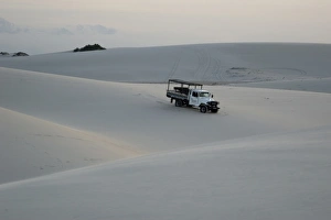 Truck trespassing sand dunes of Lencois Maranhenses National Park, Santo Amaro Truck trespassing sand dunes of Lencois Maranhenses National Park, Santo Amaro