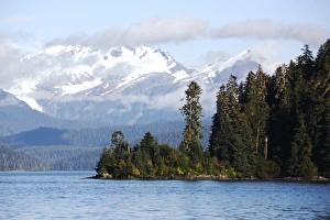 A view of the cloud covered mountains just outside Petersburg in Southeast Alaska, USA A view of the cloud covered mountains just outside Petersburg in Southeast Alaska, USA